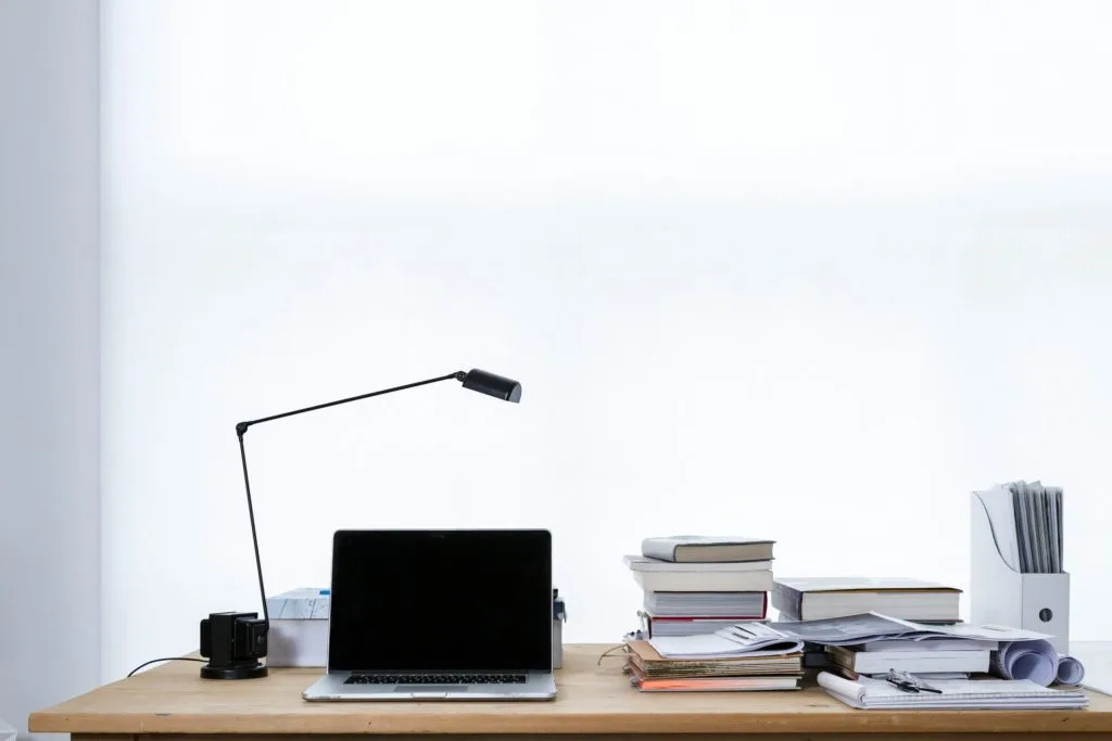 mac book pro on top of table