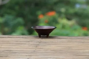 A small wooden kava bowl