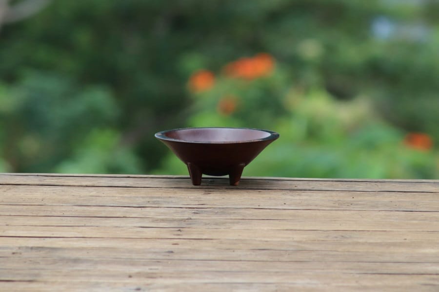 A small wooden kava bowl
