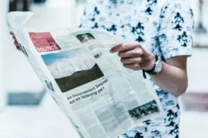 Person reading a newspaper